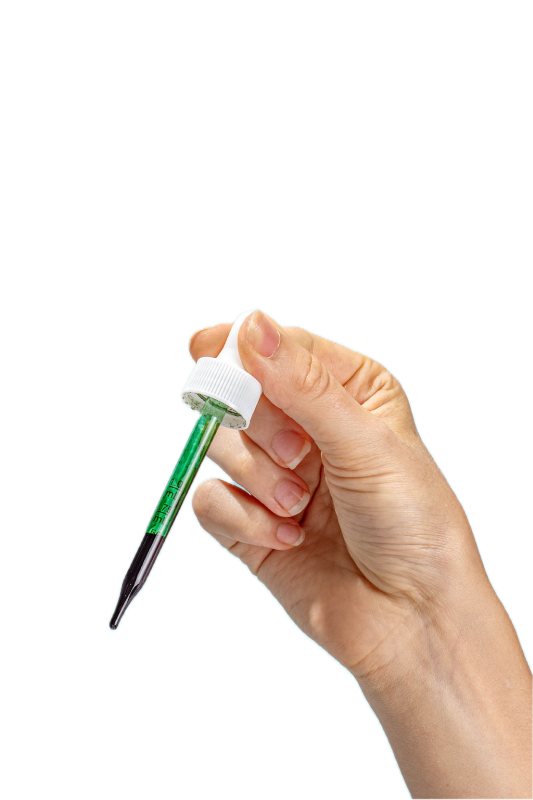 Person holding a pipette of Happy V Liquid Chlorophyll