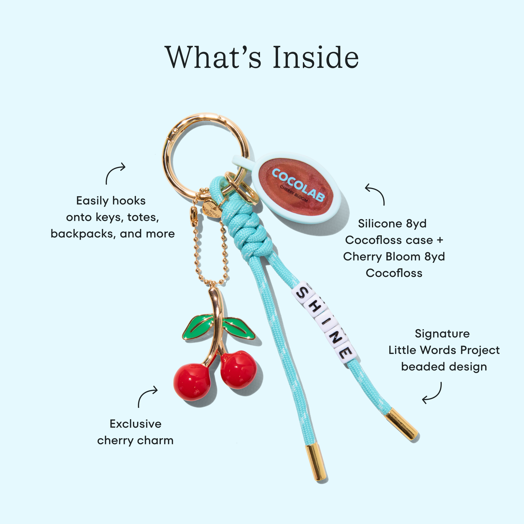 Cherry Bloom Cocofloss bag charm with blue cord and case