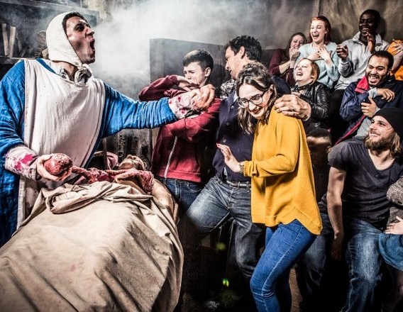 Visitors reacting inside the London Dungeon