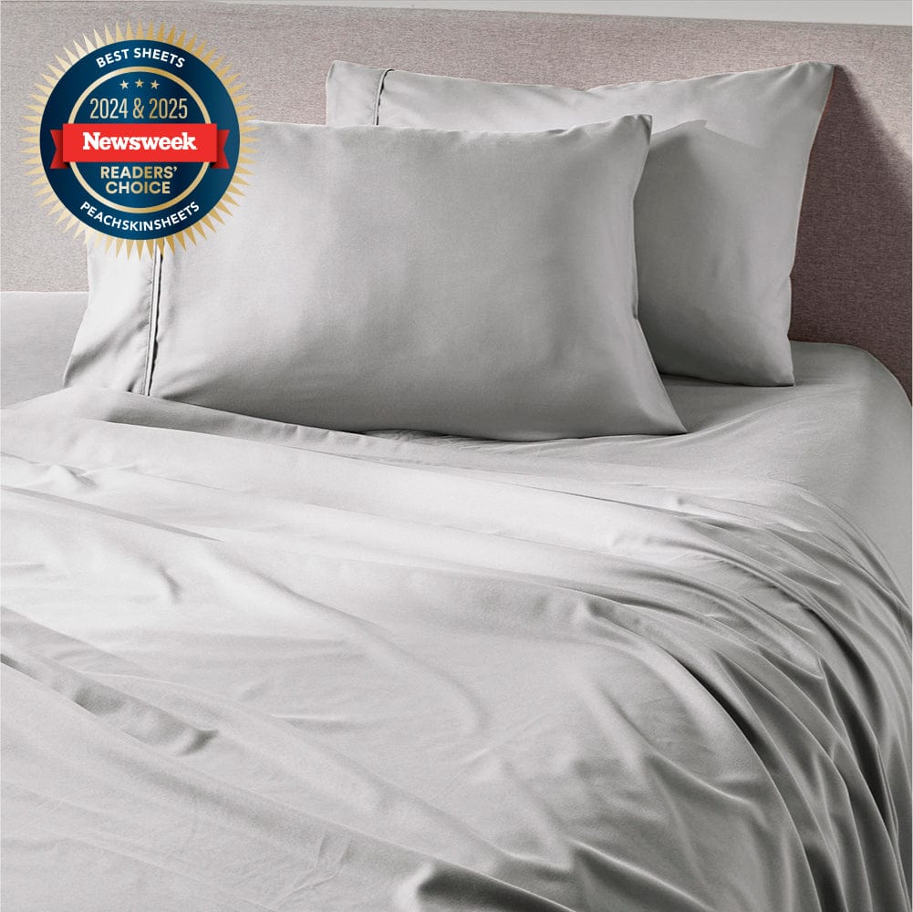 Brushed Silver sheet set styled on a made bed