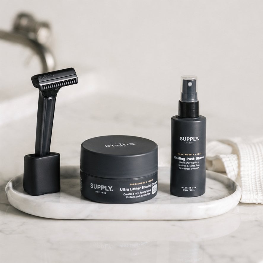 Supply sandalwood and cedar shave set arranged in a bathroom lifestyle scene
