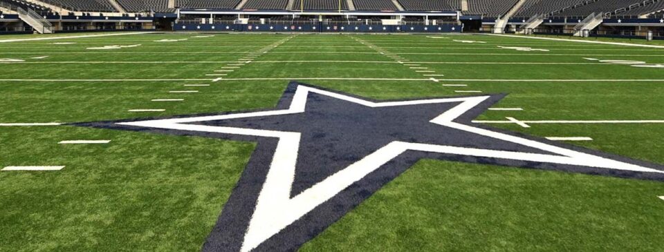 View across the AT&T Stadium field toward the stadium seating