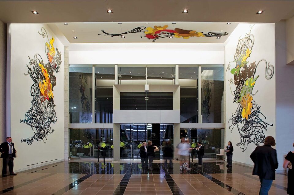 Artwork depicting a cowboy and the stadium setting