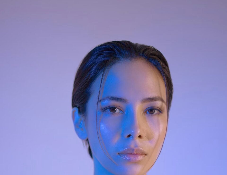 Portrait of a fashion model in a dark studio