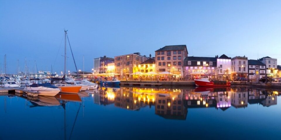 Plymouth harbour and city lights beside the water