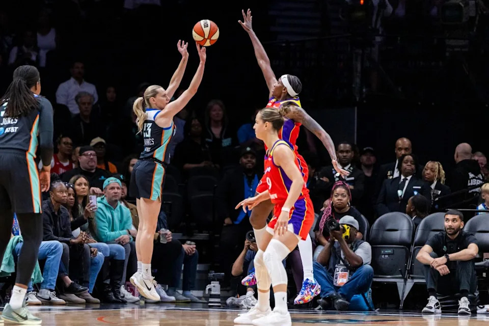 New York Liberty player shoots toward the basket against Phoenix