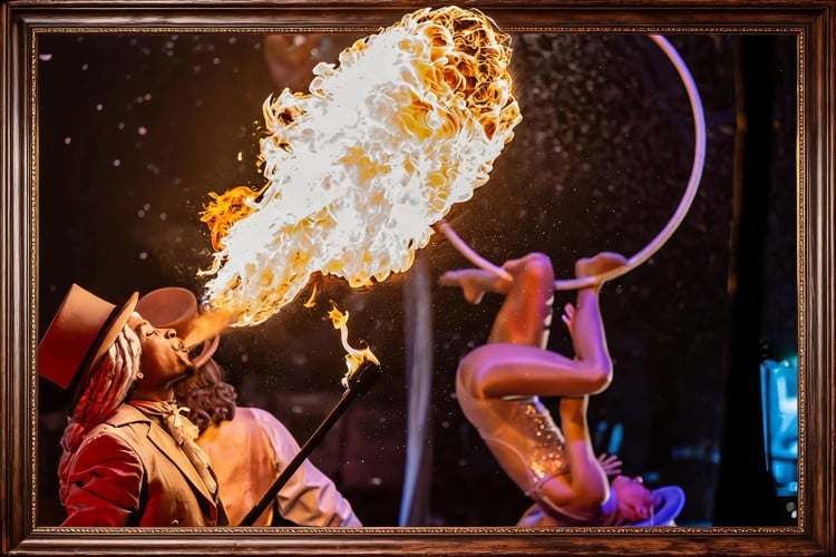 Fire-breathing performer in Scrooge Cirque Extravaganza