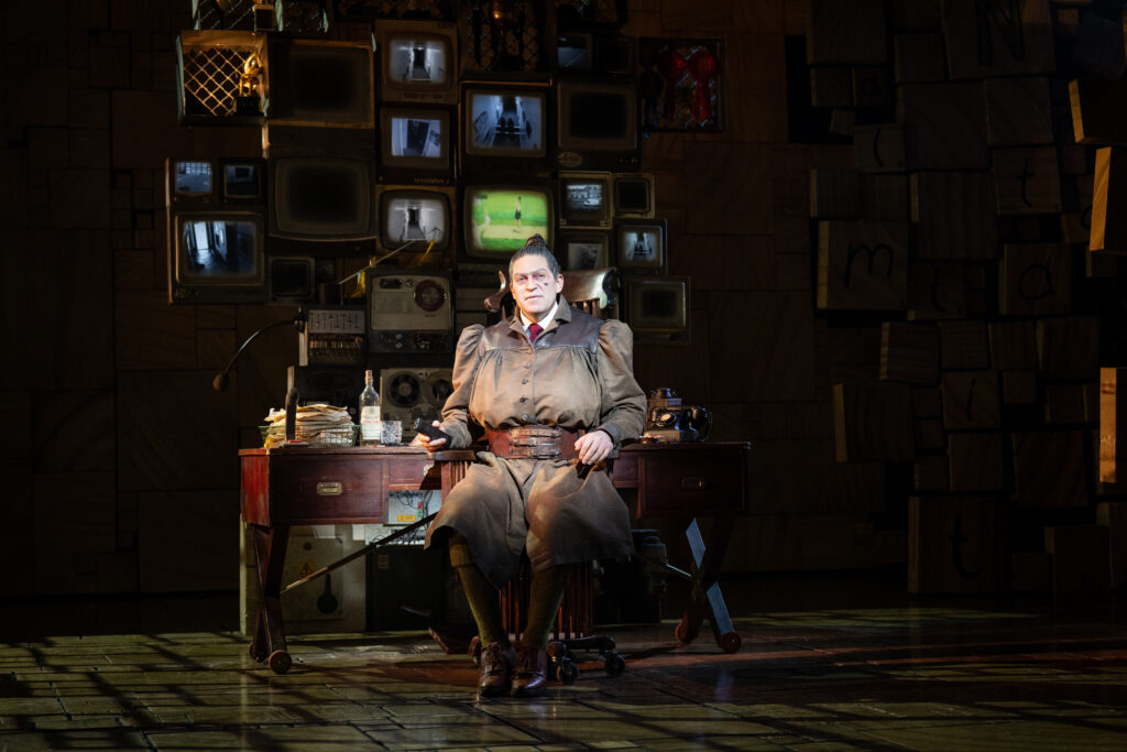 Matilda company performing on stage in a production scene