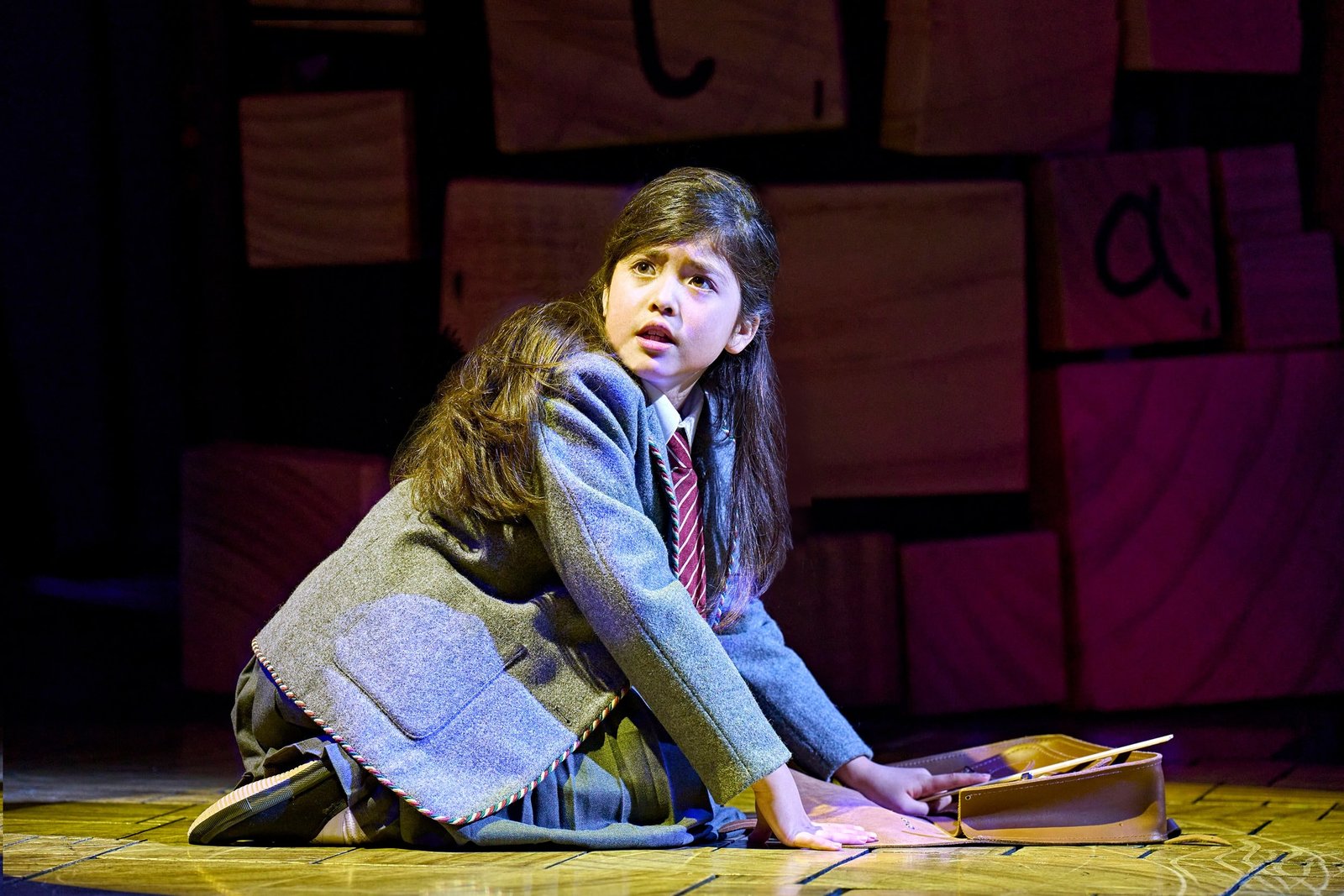 Matilda cast performing together on stage
