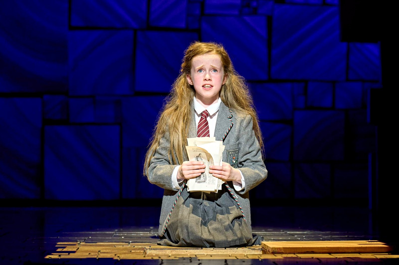 A Matilda musical stage scene with performers