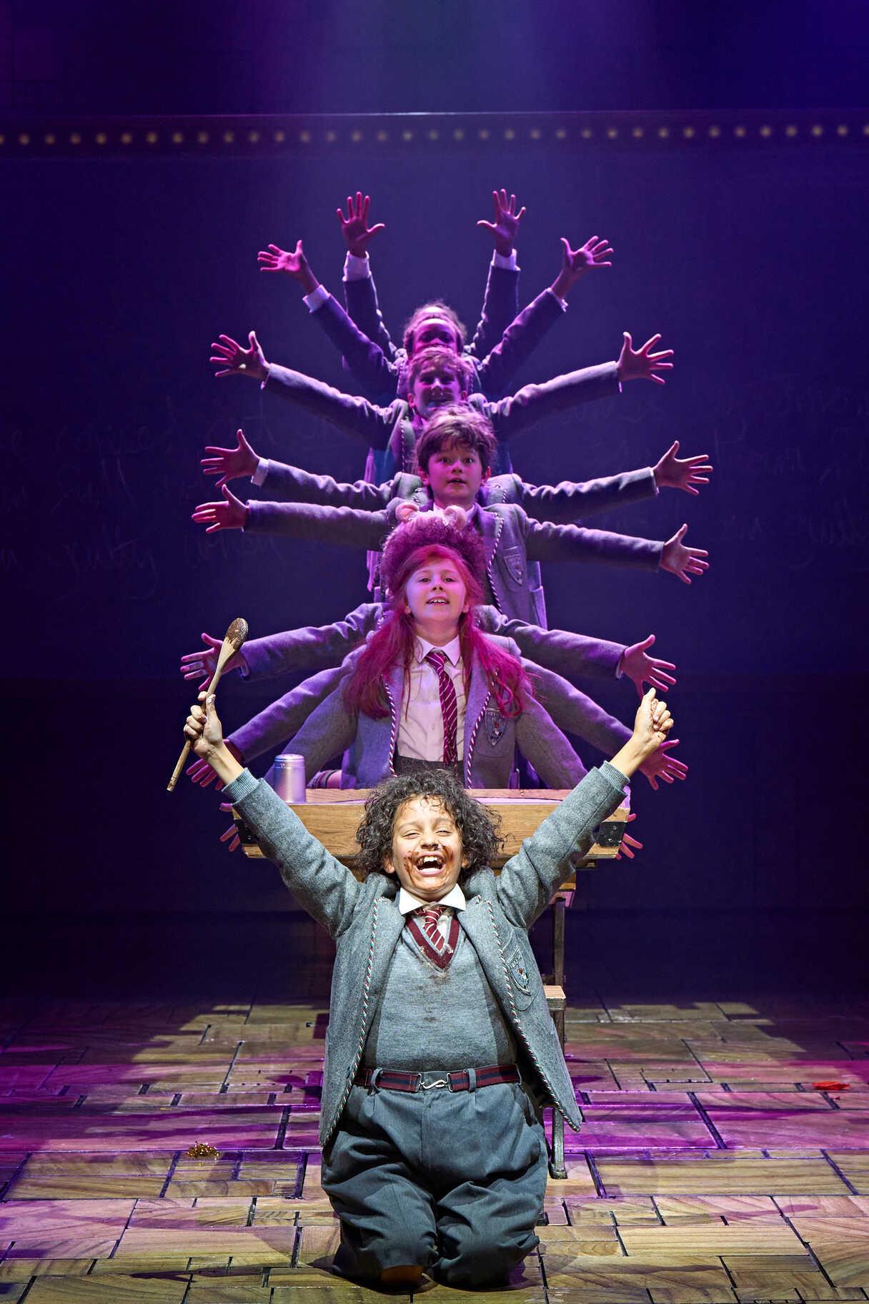 Cast performing together in a scene from Matilda The Musical