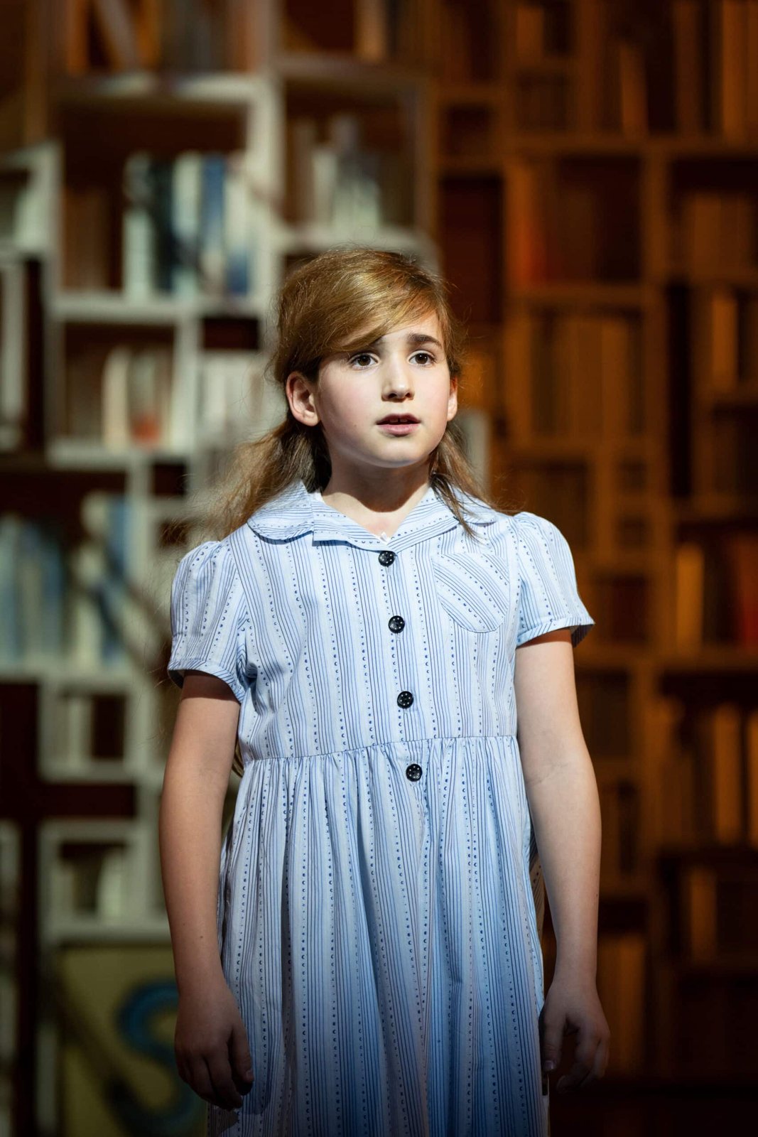 Matilda company in a staged production scene