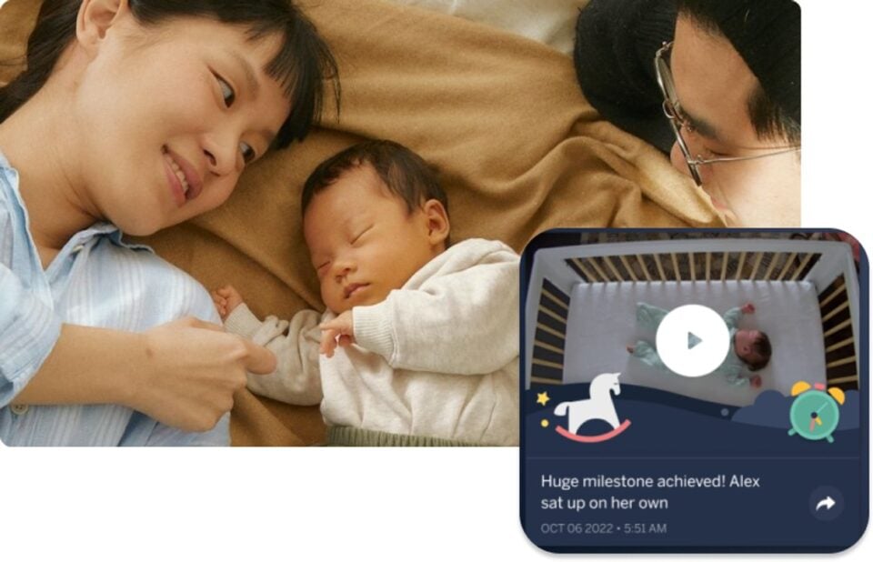 Parents with a sleeping baby and a monitor milestone view