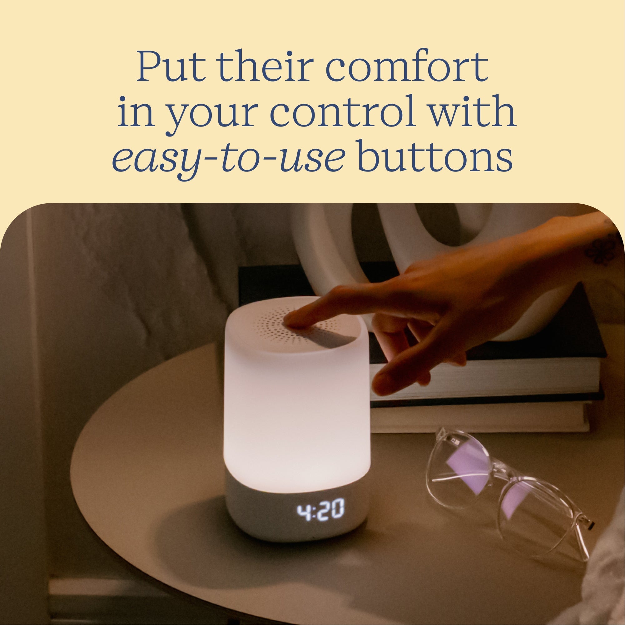 Nanit Sound + Light Machine in a nursery scene with a parent using its controls