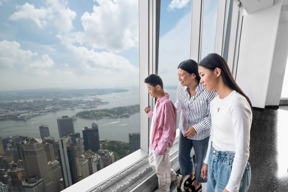 Family looking out over New York from an observation level
