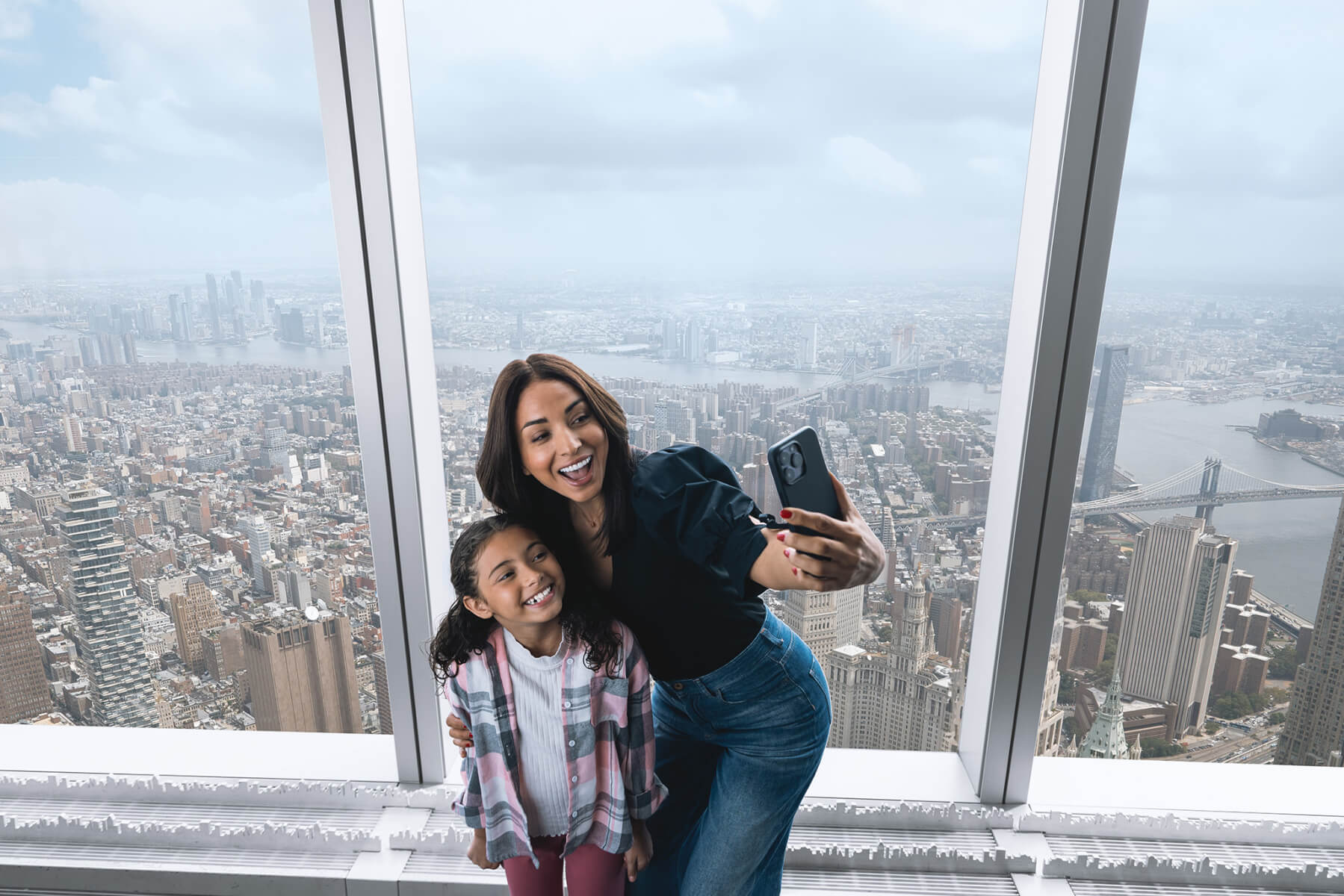 Family taking in the view at One World Observatory