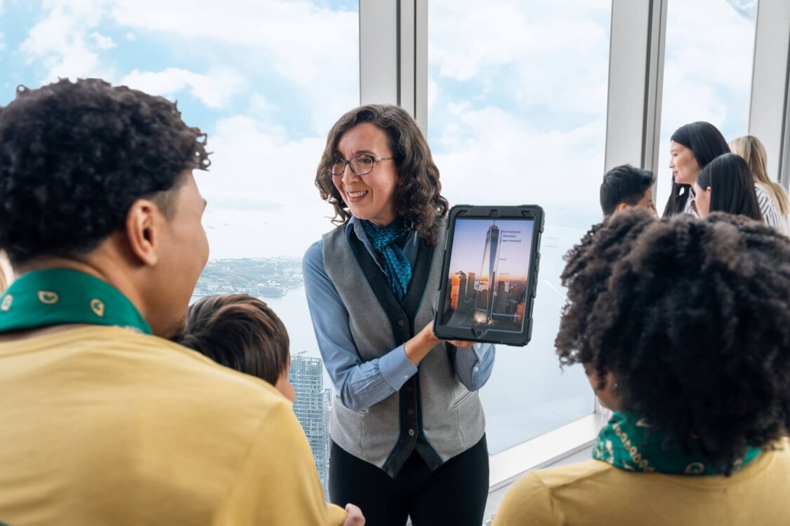 Guide leading a group through One World Observatory
