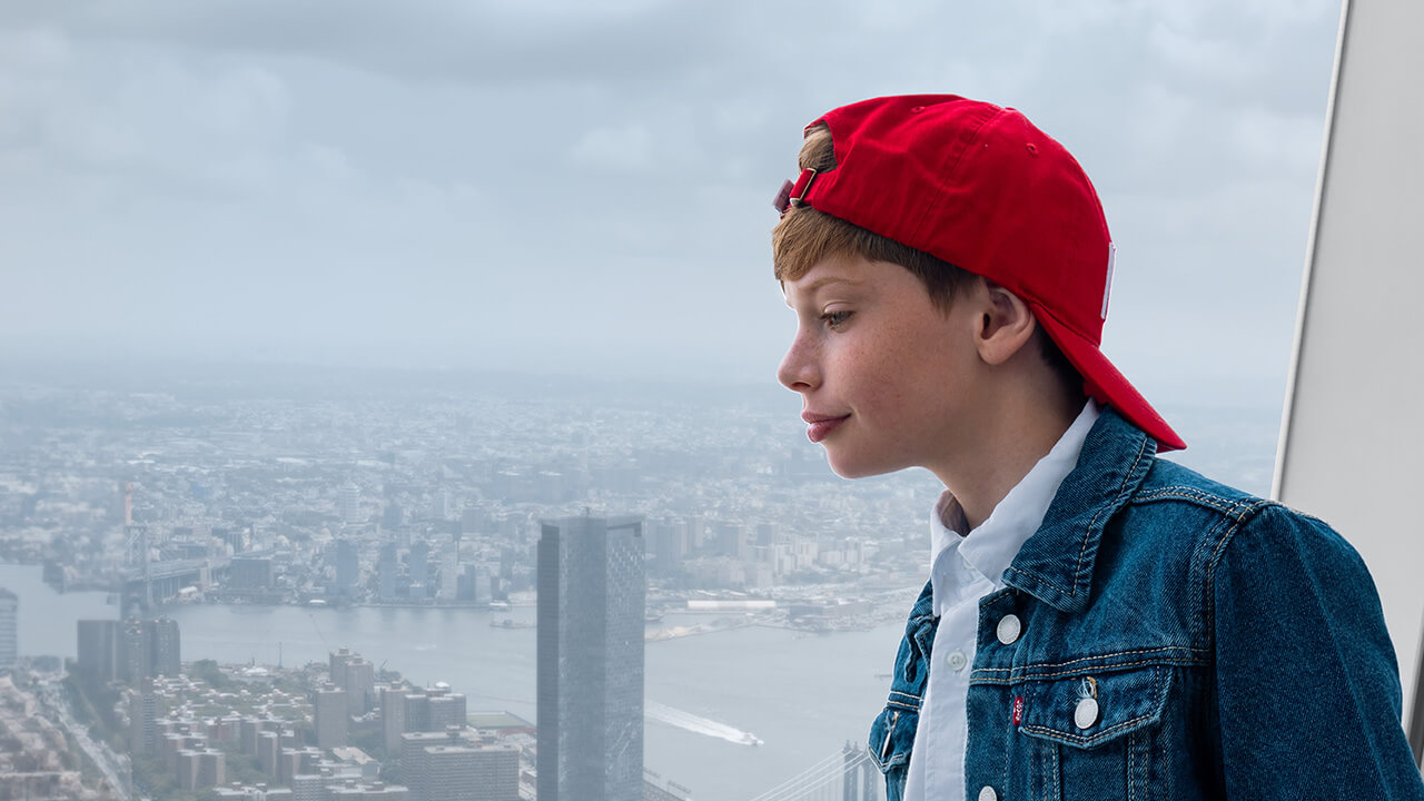 A visitor looking across Lower Manhattan and the East River