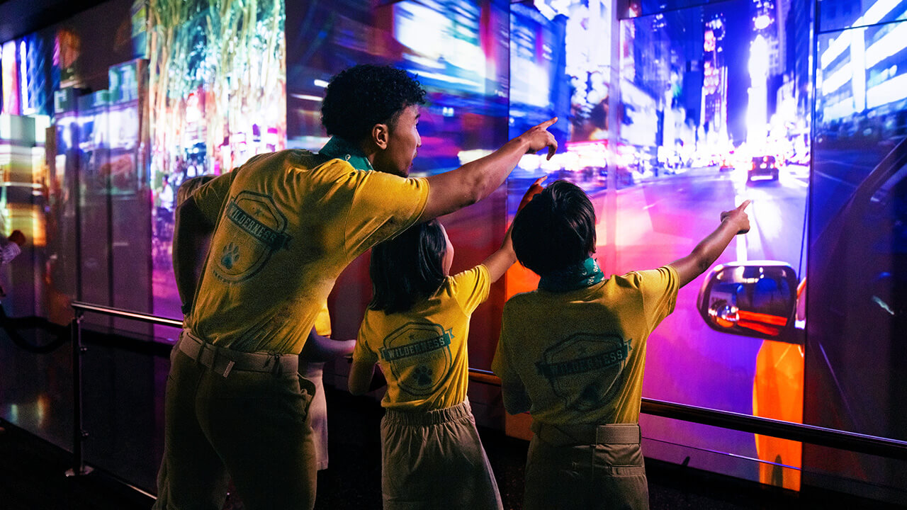 Visitors watch the city time-lapse in the See Forever Theater