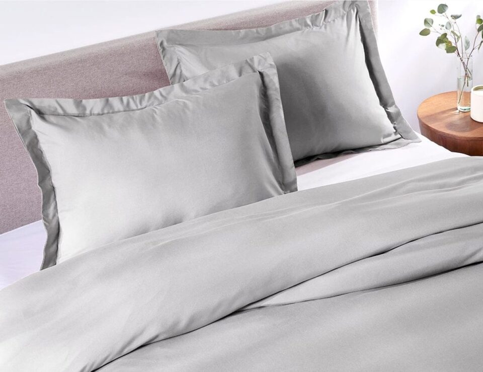 Brushed Silver duvet cover styled on a bedroom bed