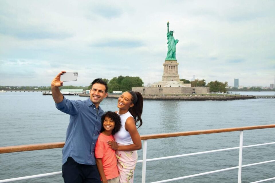 Visitors viewing the Statue of Liberty from One World Observatory