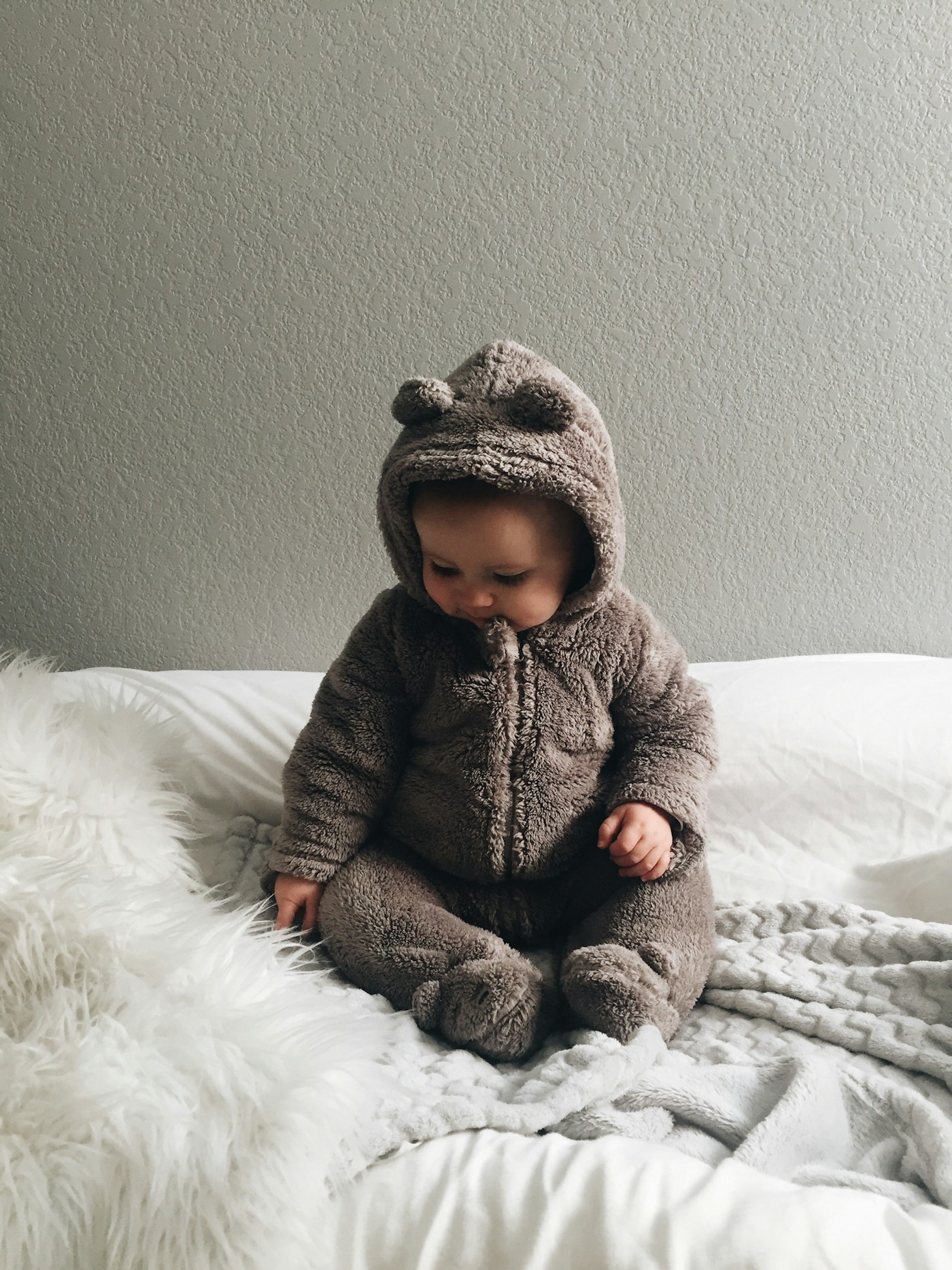 Baby wearing a bear outfit