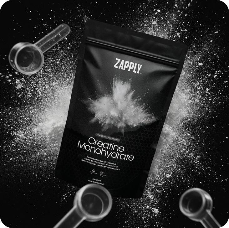 Zapply Creatine Monohydrate pouch with a burst of white powder on a dark background